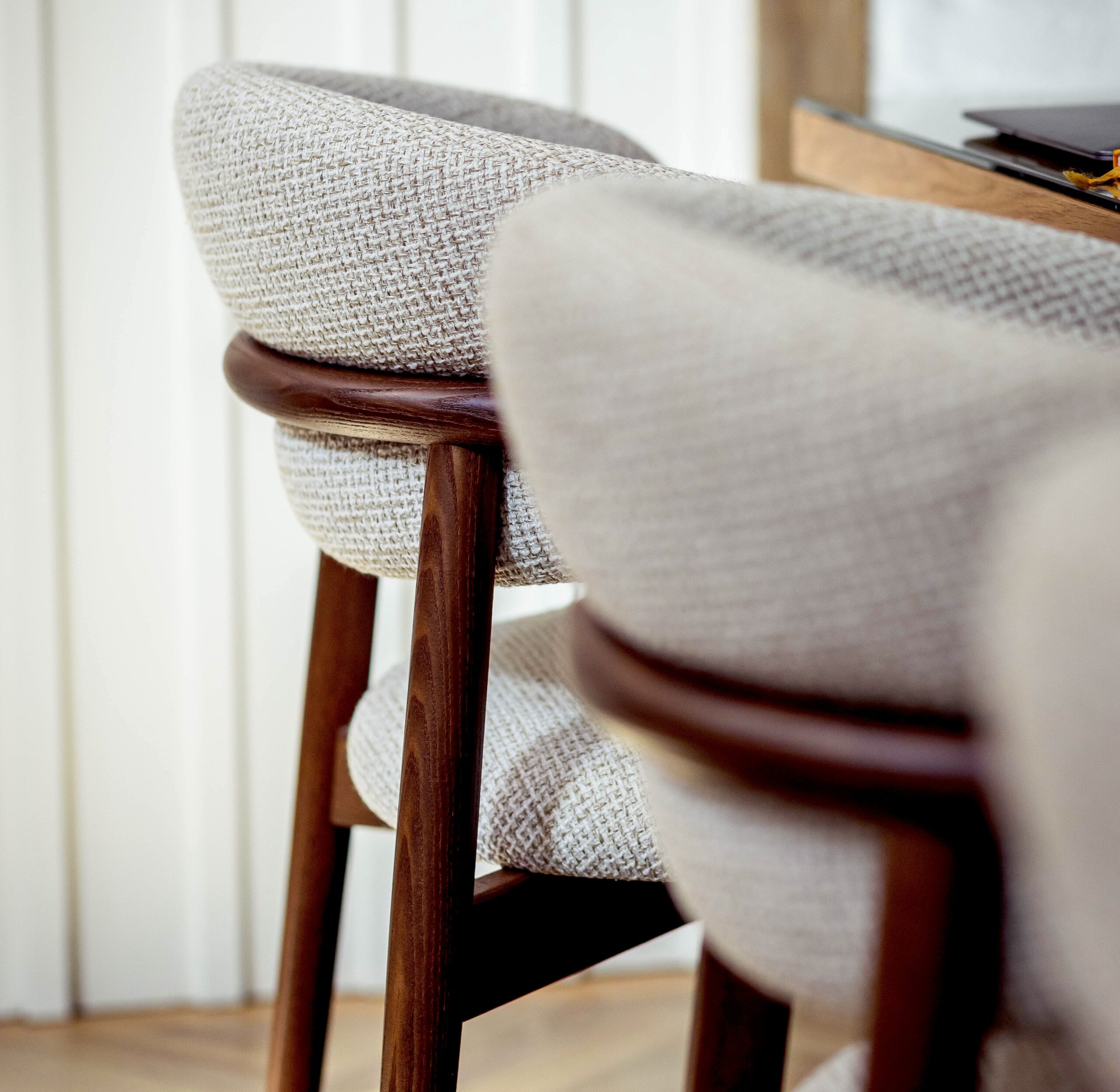 Chairs lined up at the table.